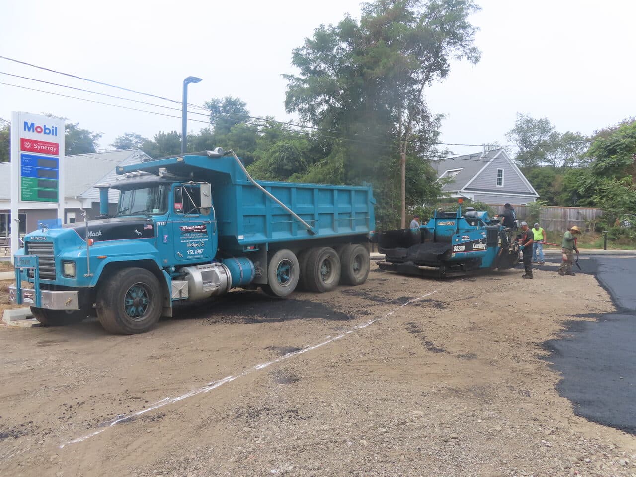 Commercial Parking Lot Paving project in Old Lyme, CT — dump truck and paver at Mobil station