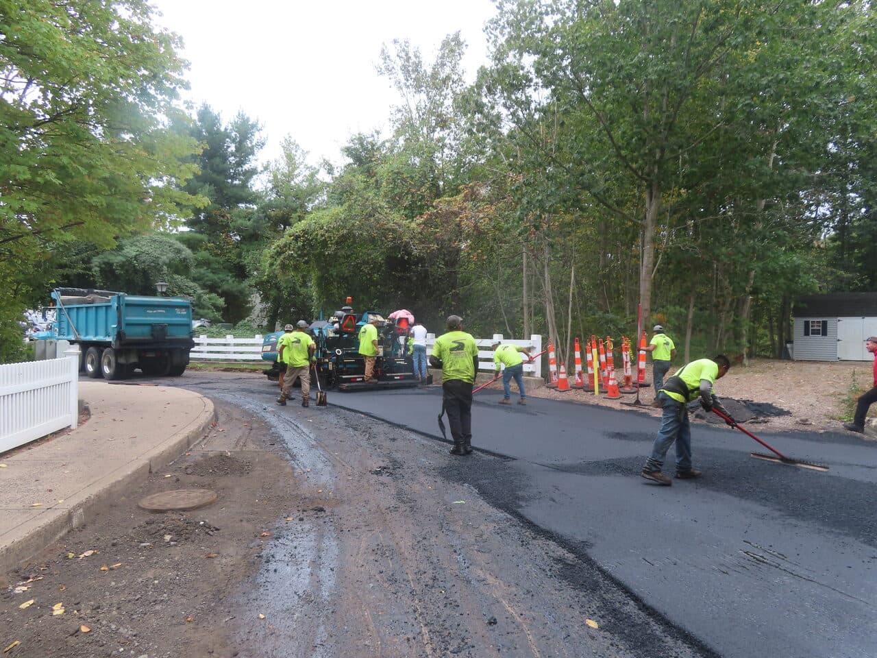 Commercial Parking Lot Paving project in Hamden, CT — crew paving curved entrance road