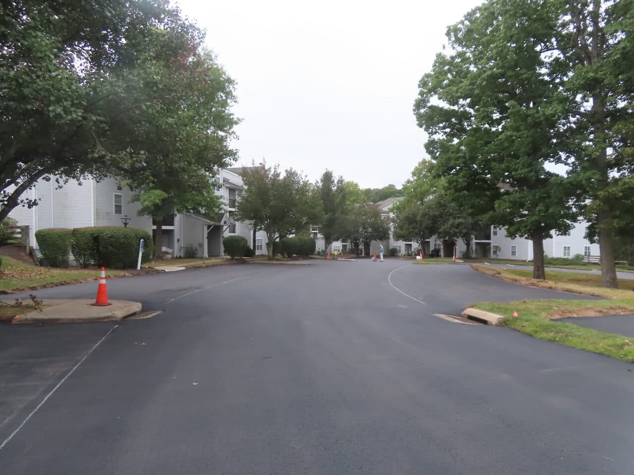 Commercial Parking Lot Paving project in Hamden, CT — finished smooth drive aisle apartments