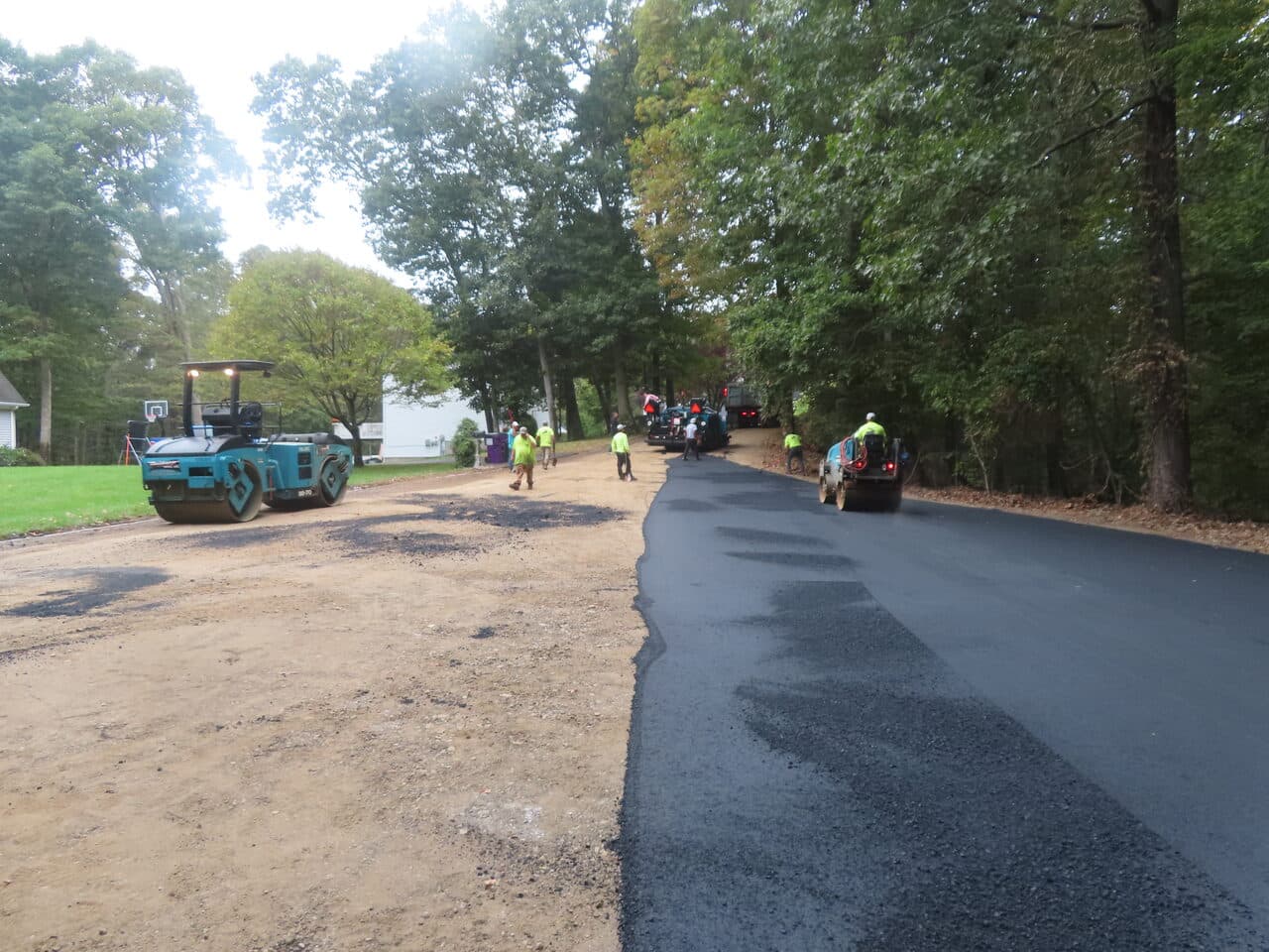 Roadway Paving project in Guilford, CT — fresh asphalt paving in progress
