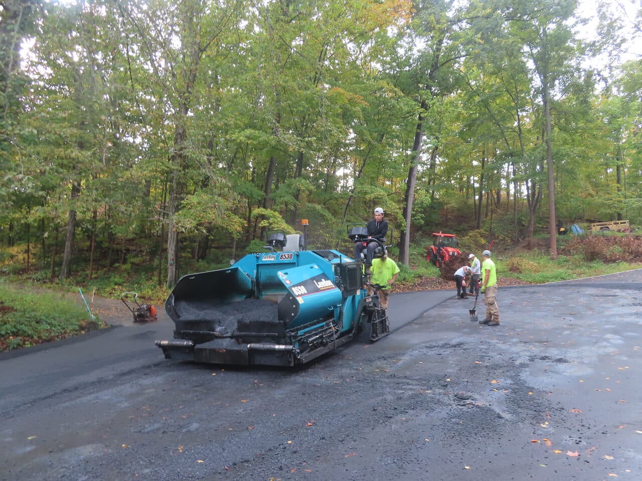 Commercial Parking Lot Paving project in North Branford, CT — asphalt paver laying new road