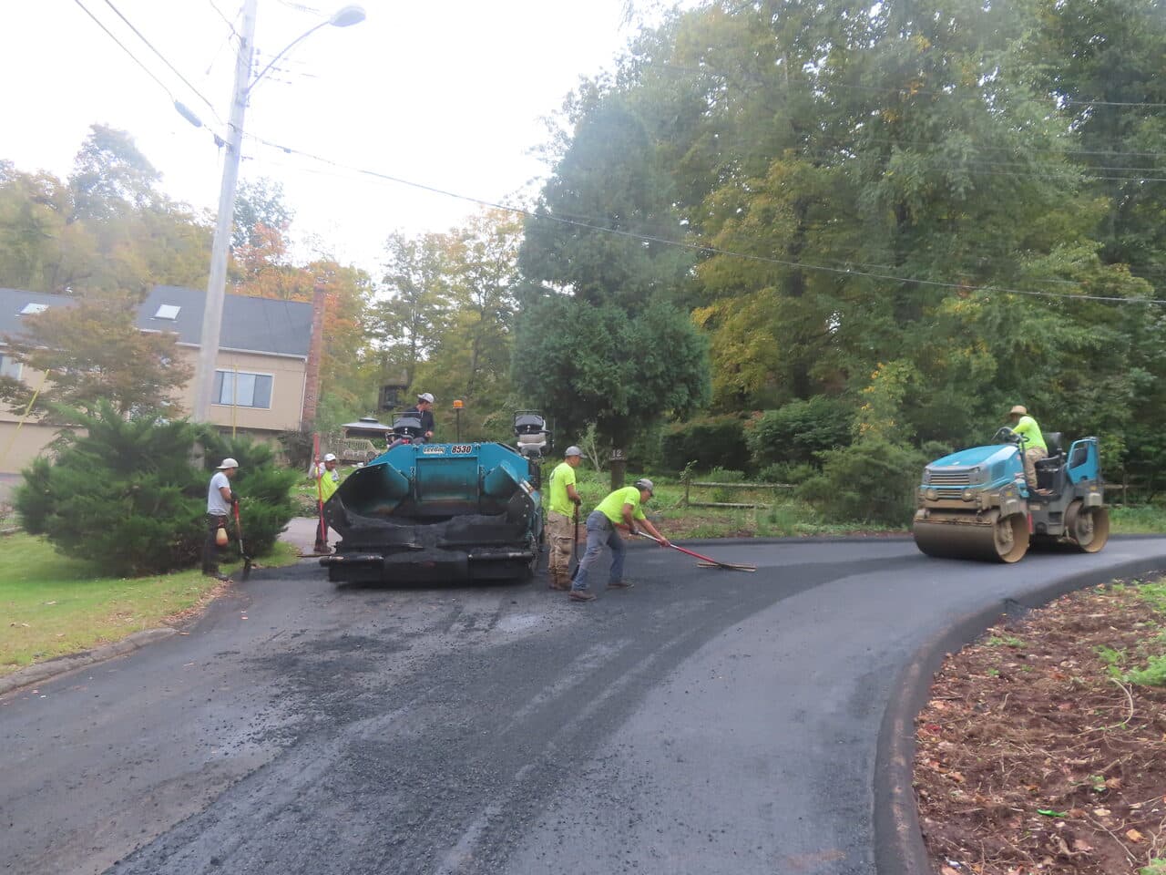 Commercial Parking Lot Paving project in North Branford, CT — paver and roller paving road
