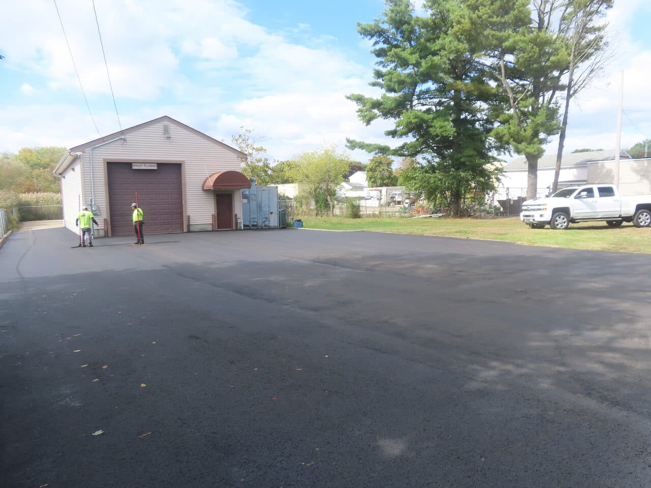 After — Commercial Parking Lot Paving in East Haven, CT (roller compacting new parking lot)