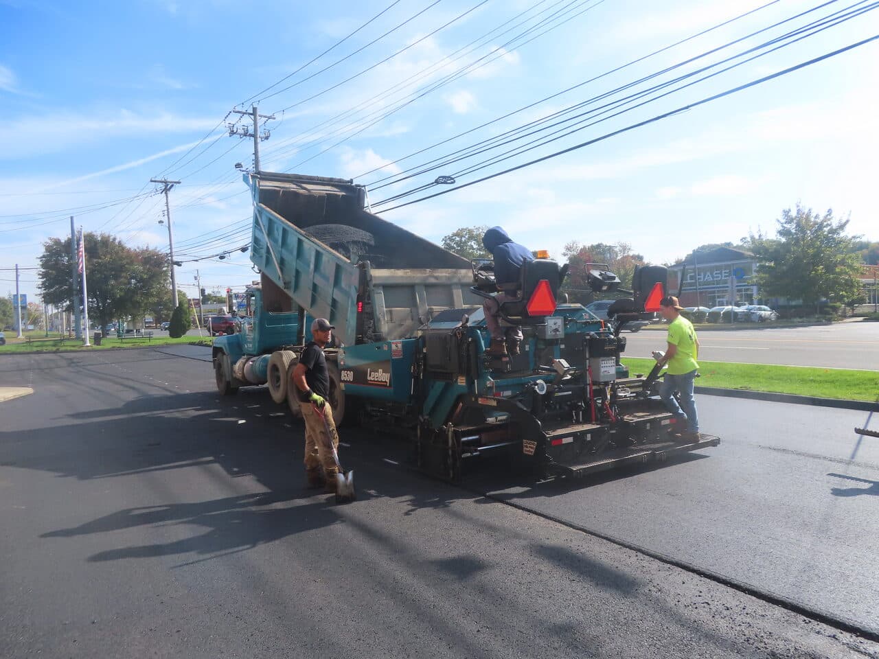 Commercial Parking Lot Paving project in Orange, CT — asphalt paver laying new mat