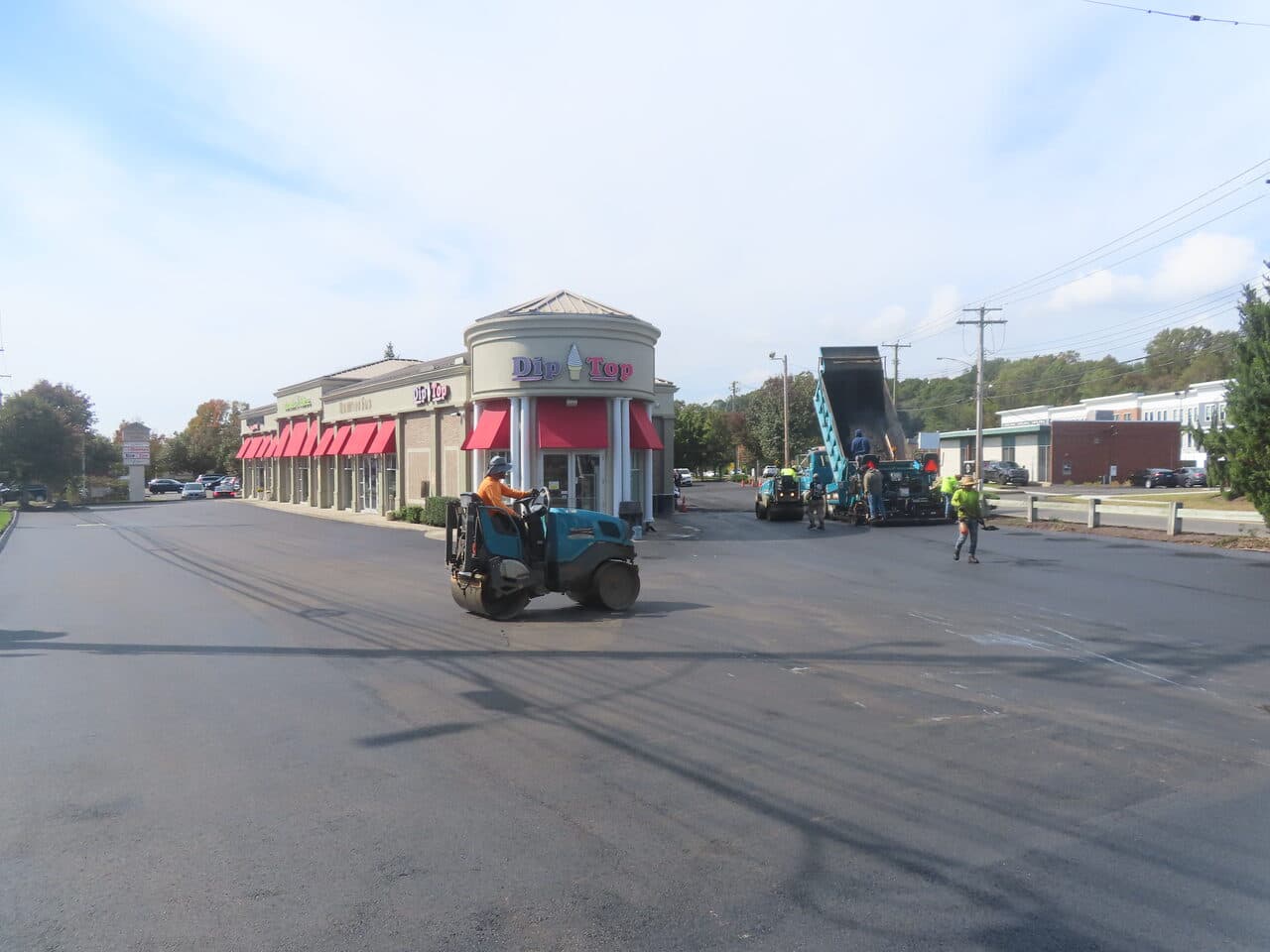 Commercial Parking Lot Paving project in Orange, CT — wide finished lot at Dip Top plaza