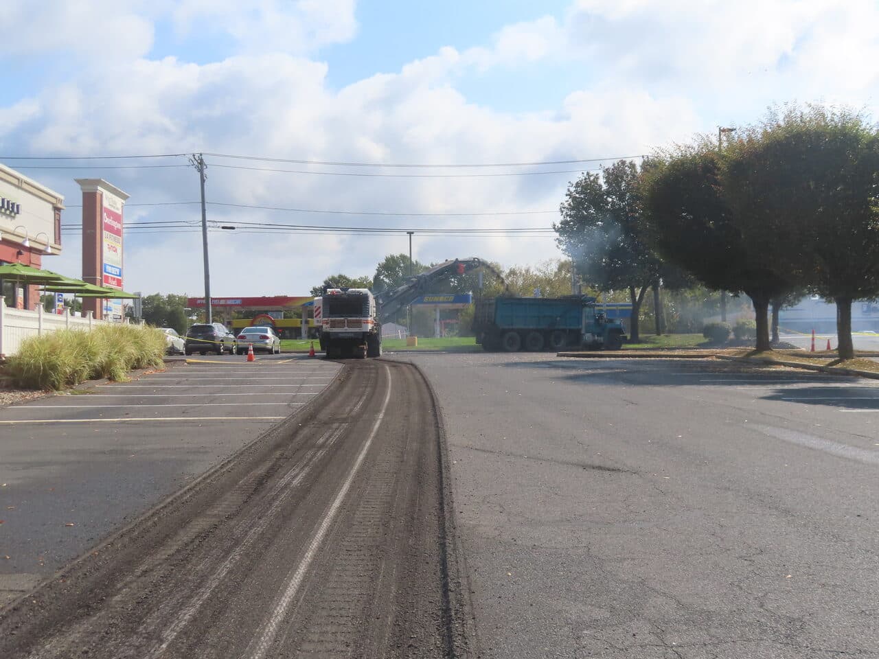 Commercial Parking Lot Paving project in Farmington, CT — milled lane leading to machines