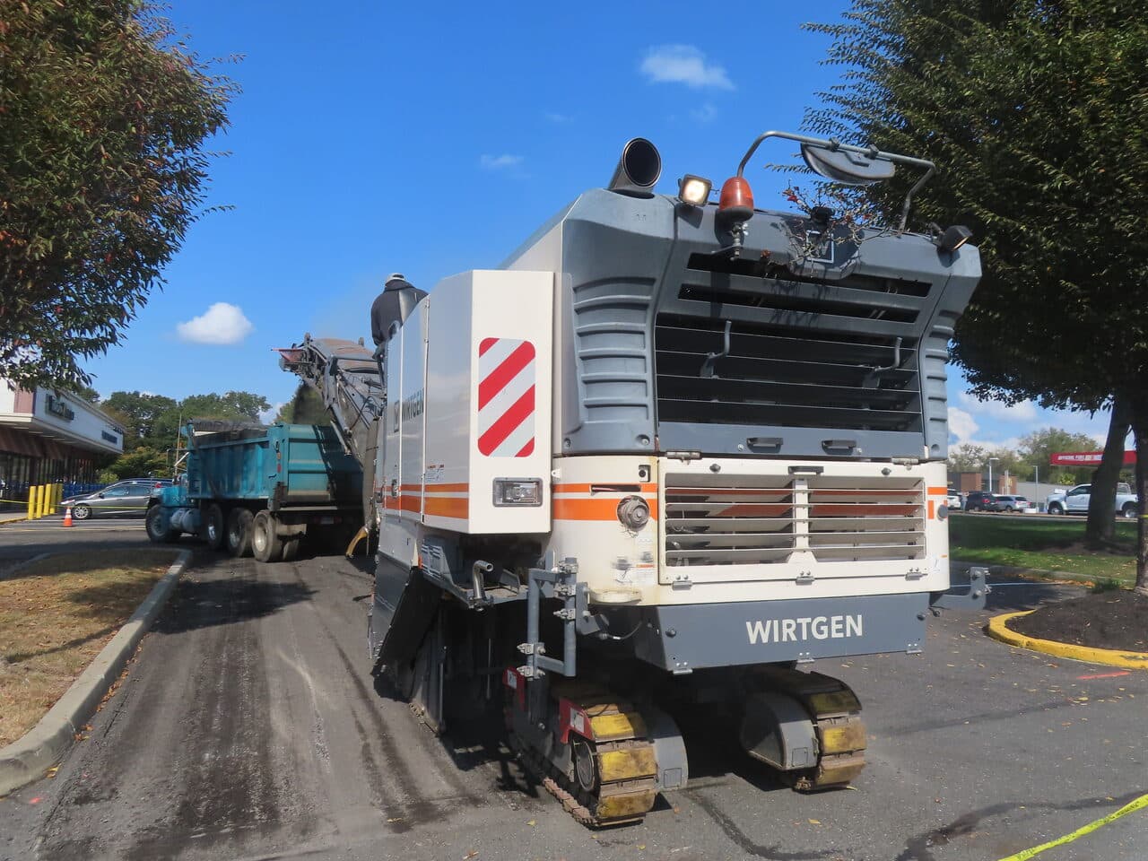 Commercial Parking Lot Paving project in Farmington, CT — Wirtgen miller loading dump truck