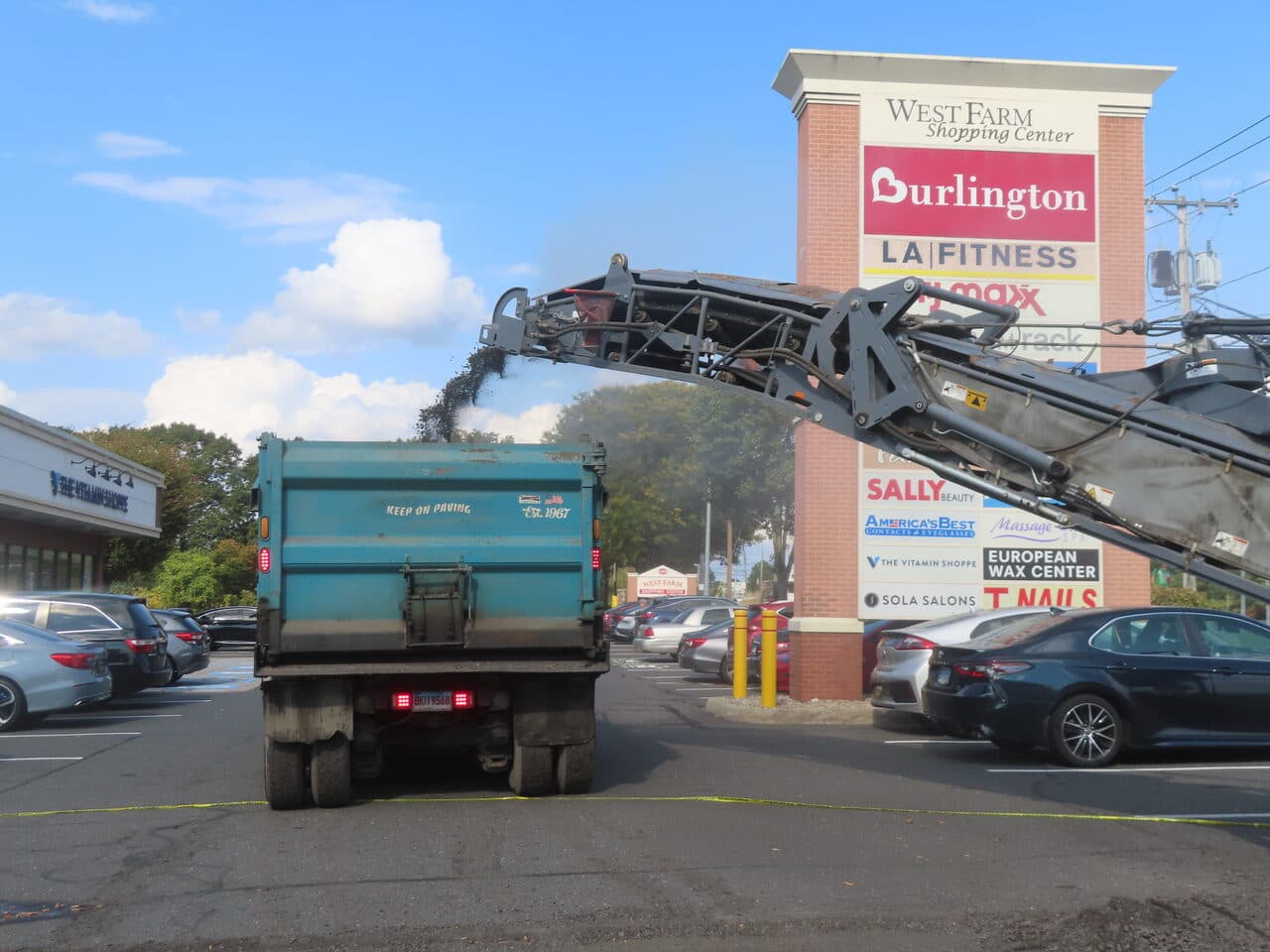 Commercial Parking Lot Paving project in Farmington, CT — miller conveyor loading truck at sign