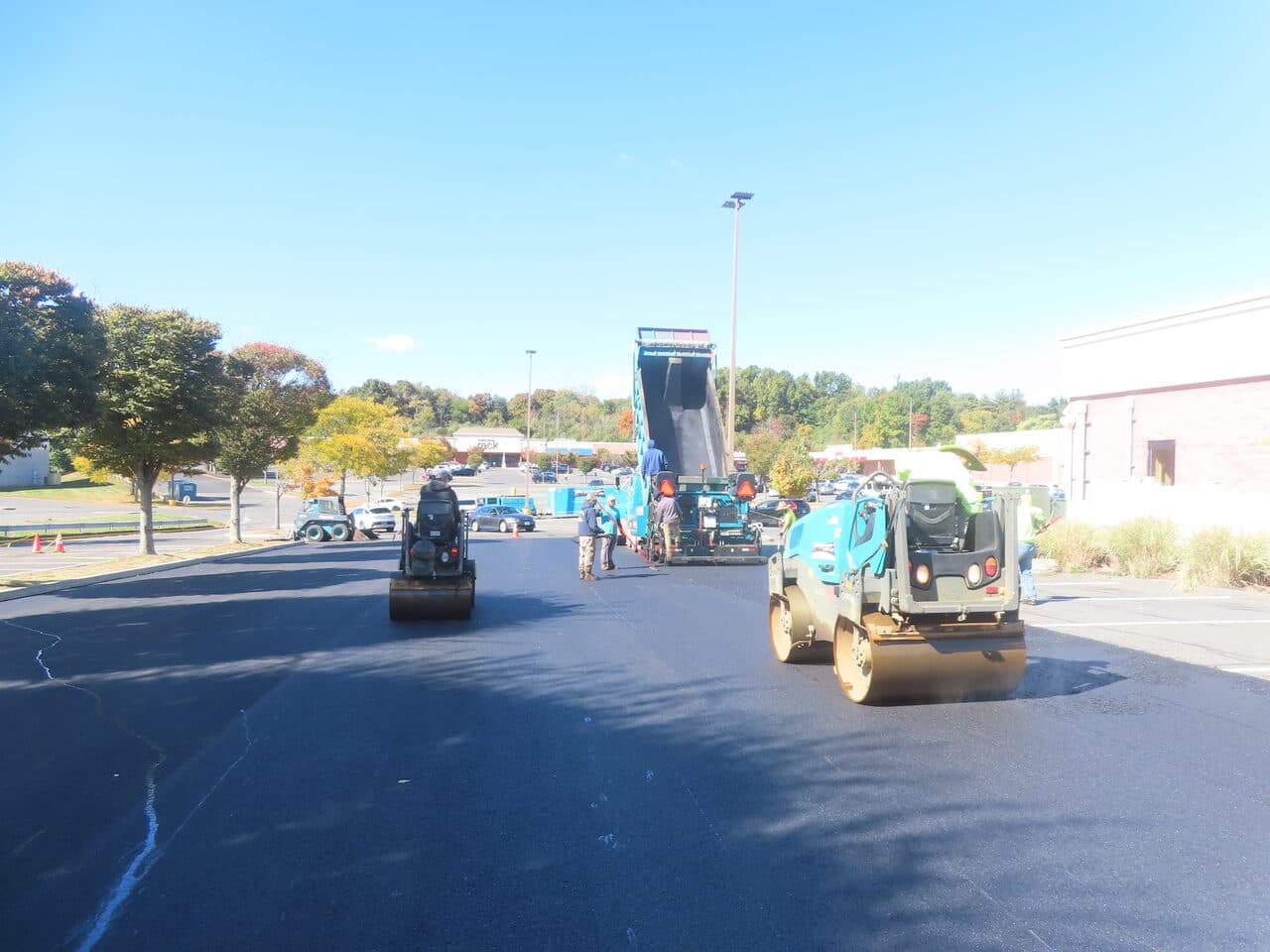 Commercial Parking Lot Paving project in Farmington, CT — rollers compacting new asphalt drive