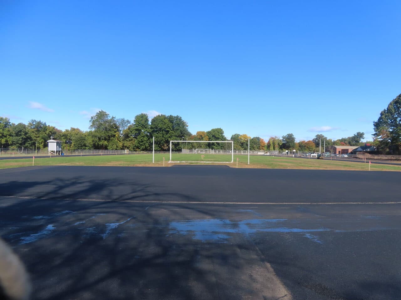 Athletic Surface Base Paving project in East Windsor, CT — finished paved track with soccer goal