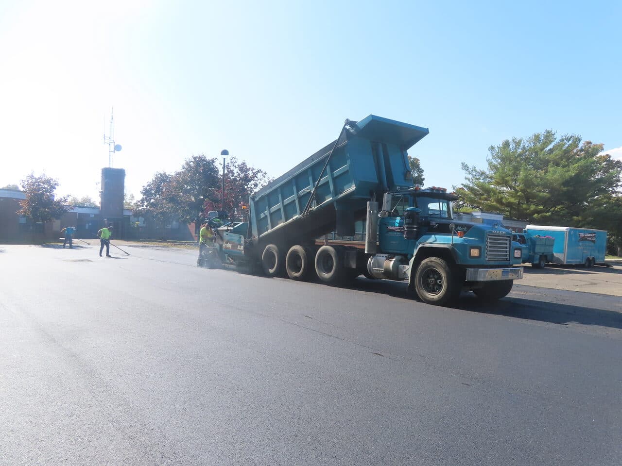 Commercial Parking Lot Paving project in West Haven, CT — dump truck feeding paver