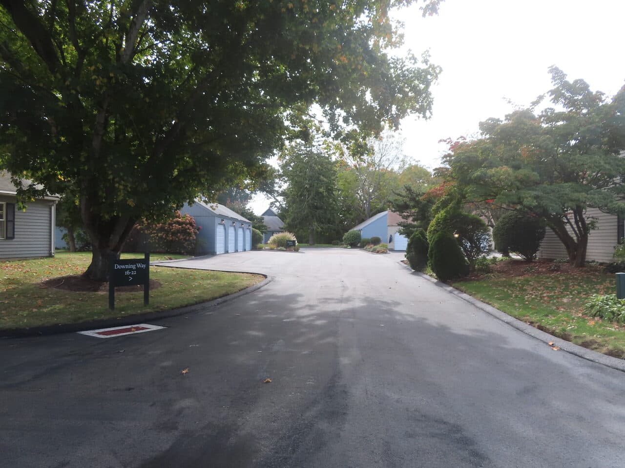 Roadway Paving project in Madison, CT — finished asphalt road with sign