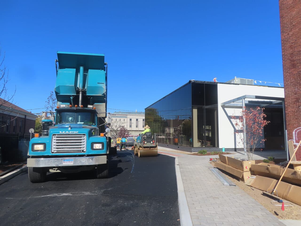 Commercial Parking Lot Paving project in Hartford, CT — finished fresh asphalt drive lane