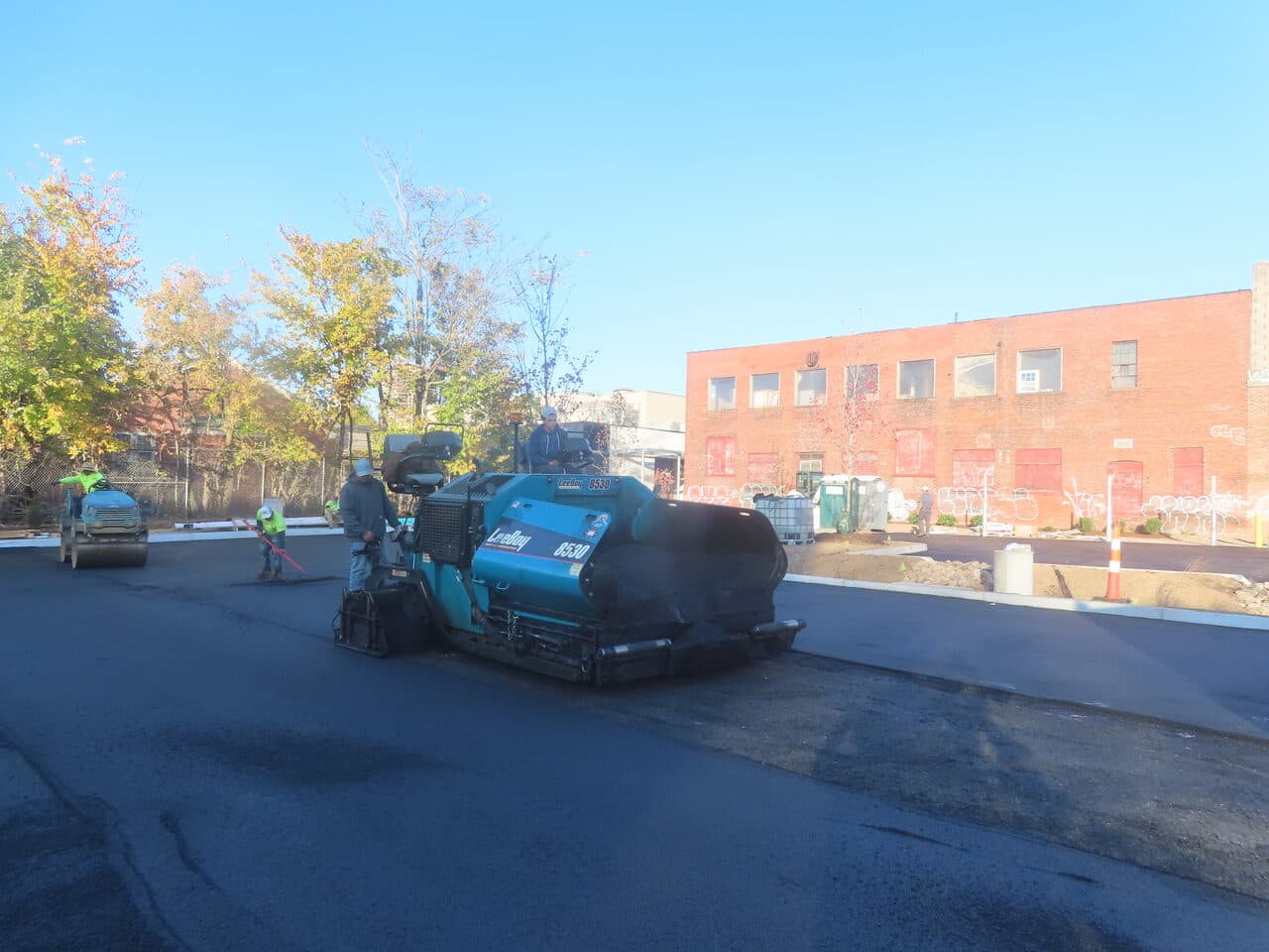 Commercial Parking Lot Paving project in Hartford, CT — paver laying asphalt parking lot