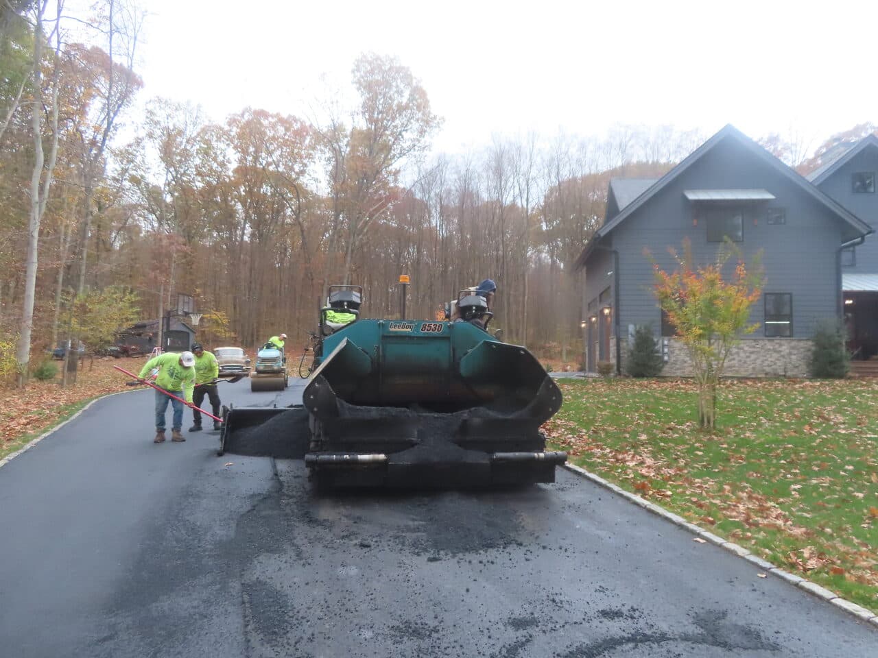 Residential Driveway Paving project in North Haven, CT — asphalt paver laying driveway