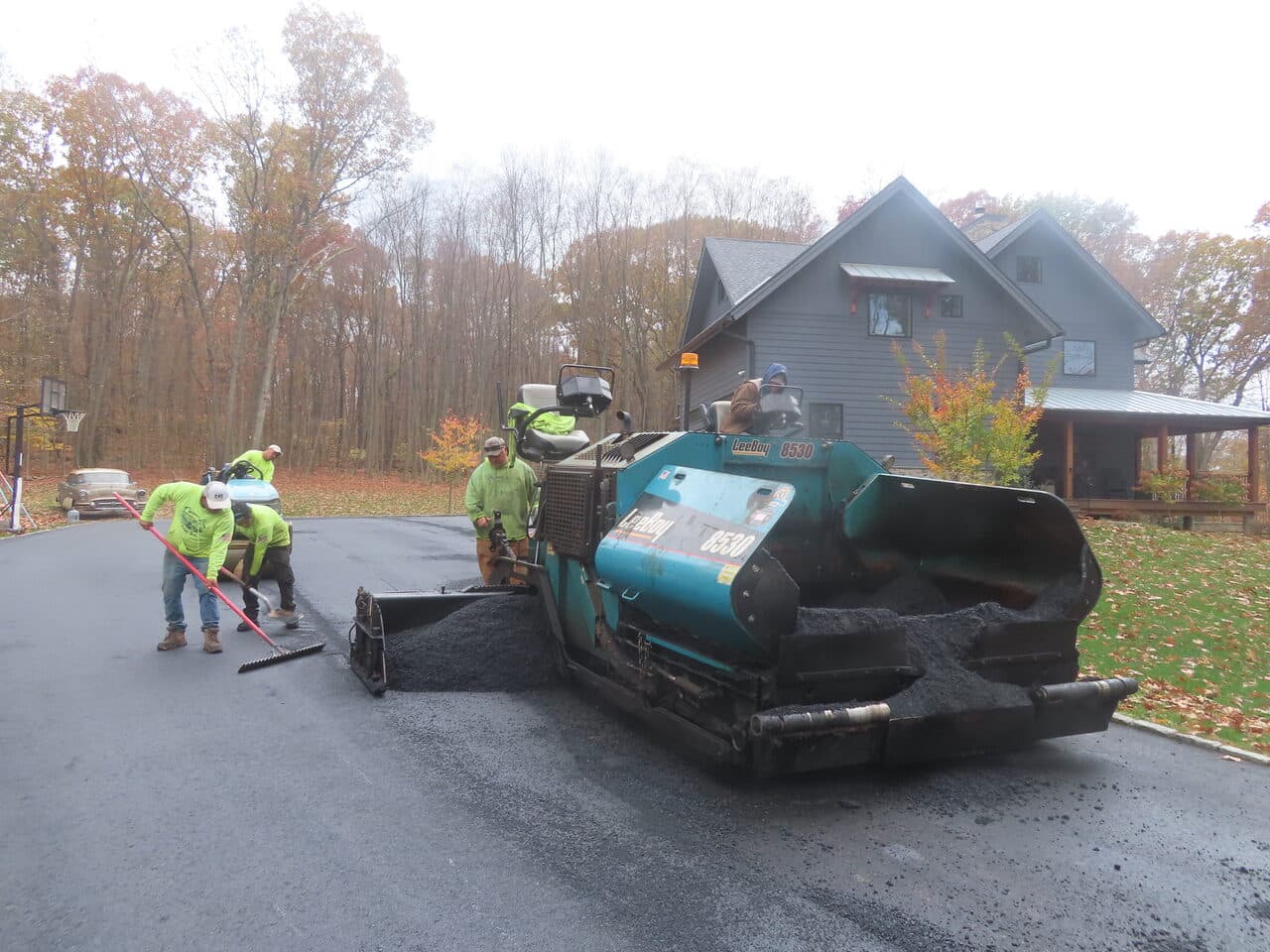 Residential Driveway Paving project in North Haven, CT — paving crew with LeeBoy paver