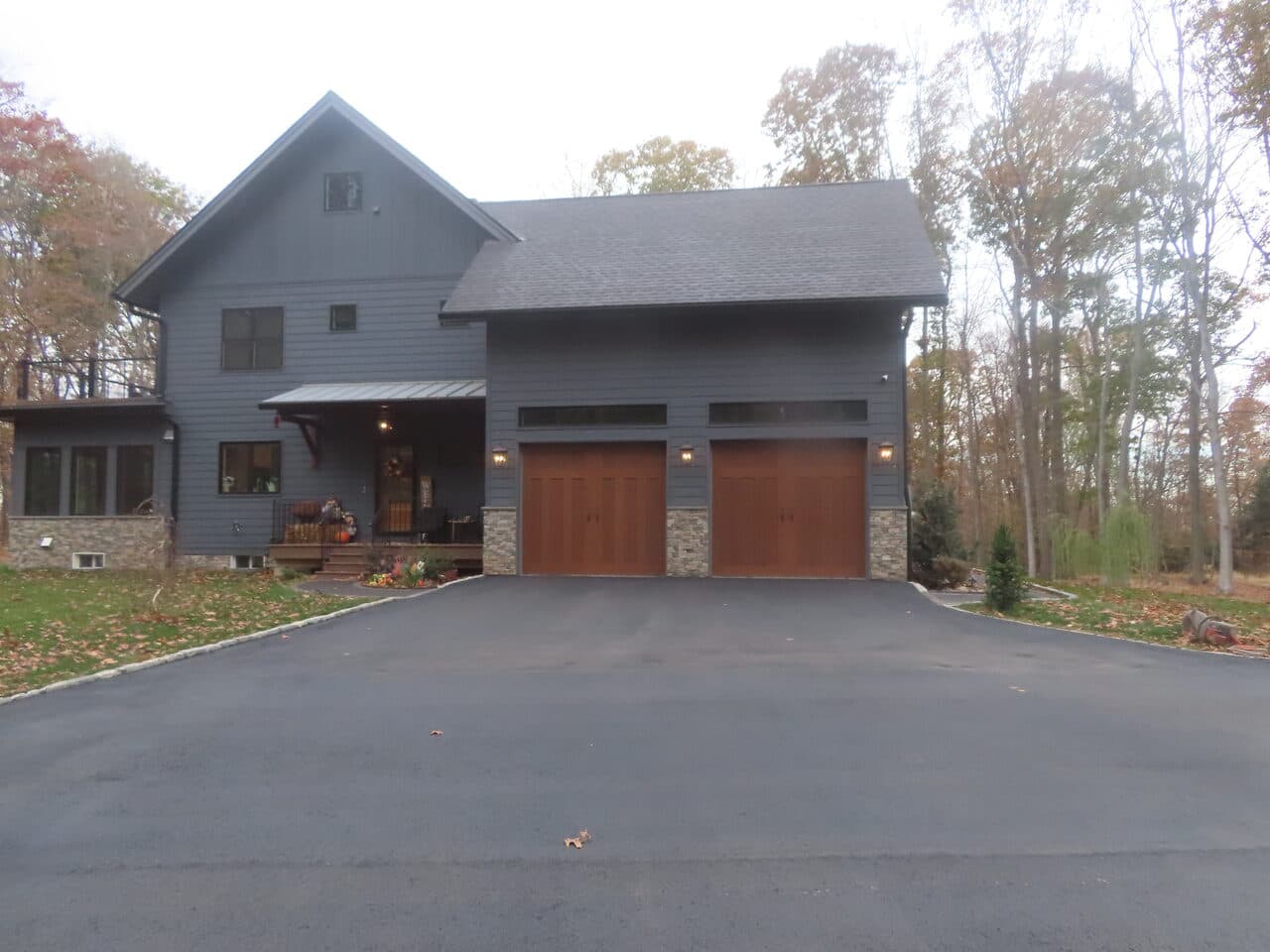 Residential Driveway Paving project in North Haven, CT — finished driveway at gray home