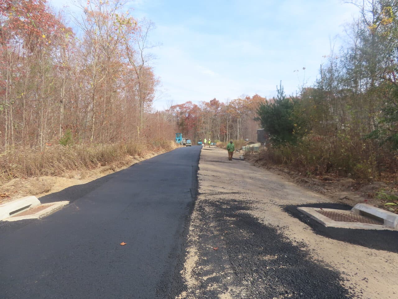 Roadway Paving project in Higganum, CT — fresh asphalt road with catch basins