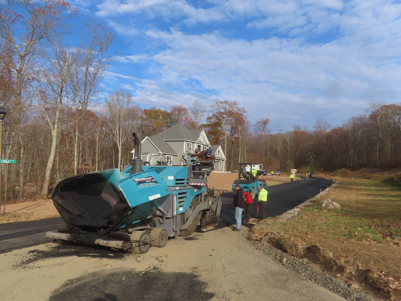 Roadway Paving project in Higganum, CT — paver paving road by home