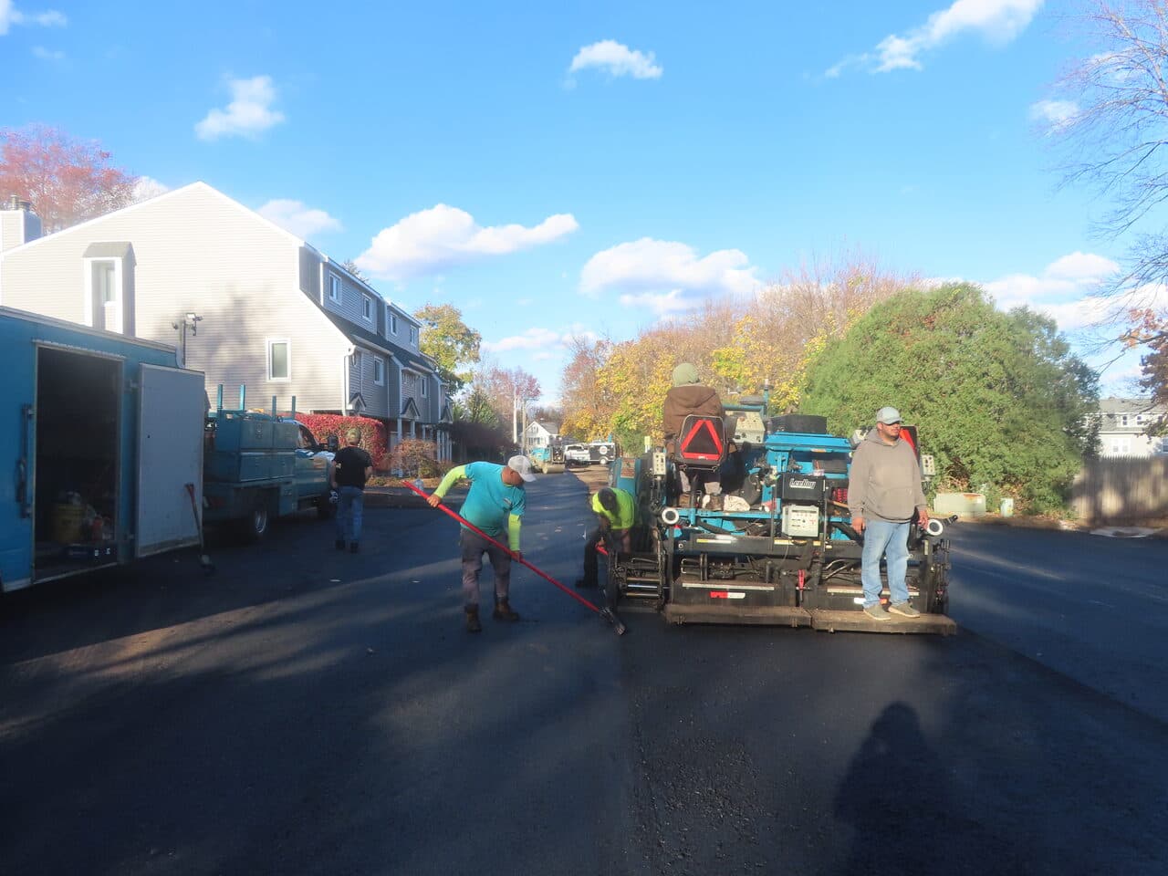 Commercial Parking Lot Paving project in Meriden, CT — crew paving road with paver