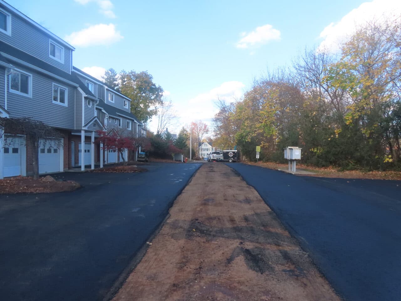 Commercial Parking Lot Paving project in Meriden, CT — new road with unpaved center strip