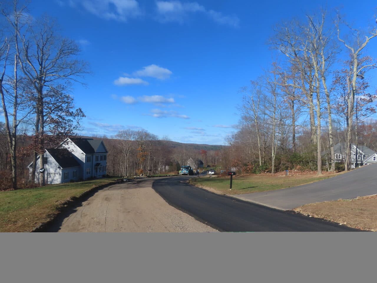 Roadway Paving project in Higganum, CT — road transition gravel to asphalt