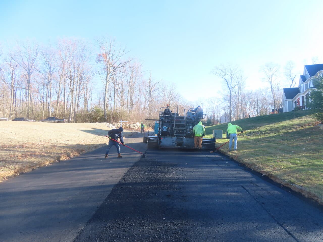 Roadway Paving project in Higganum, CT — crew paving residential driveway