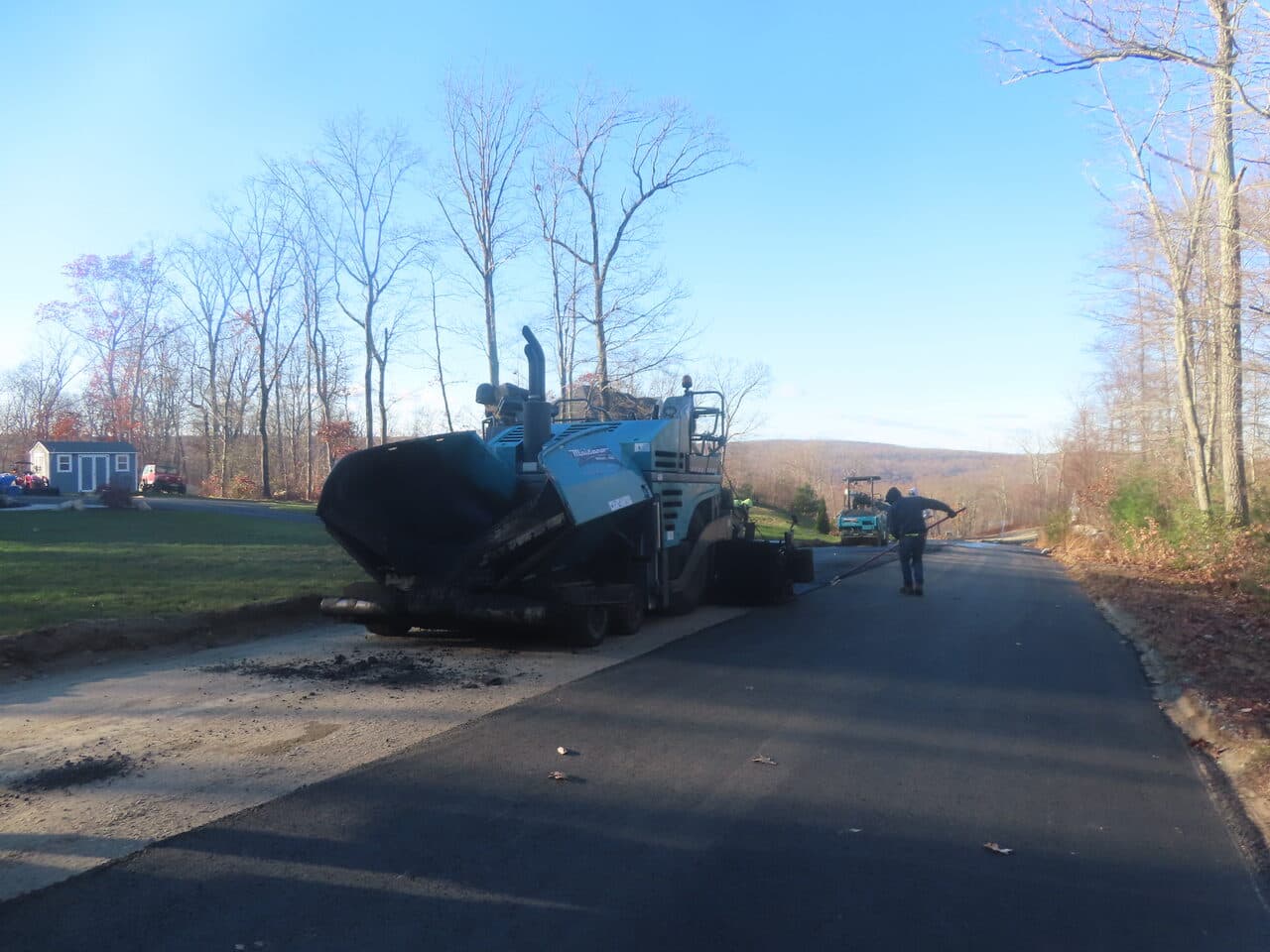 Roadway Paving project in Higganum, CT — asphalt paver on new road