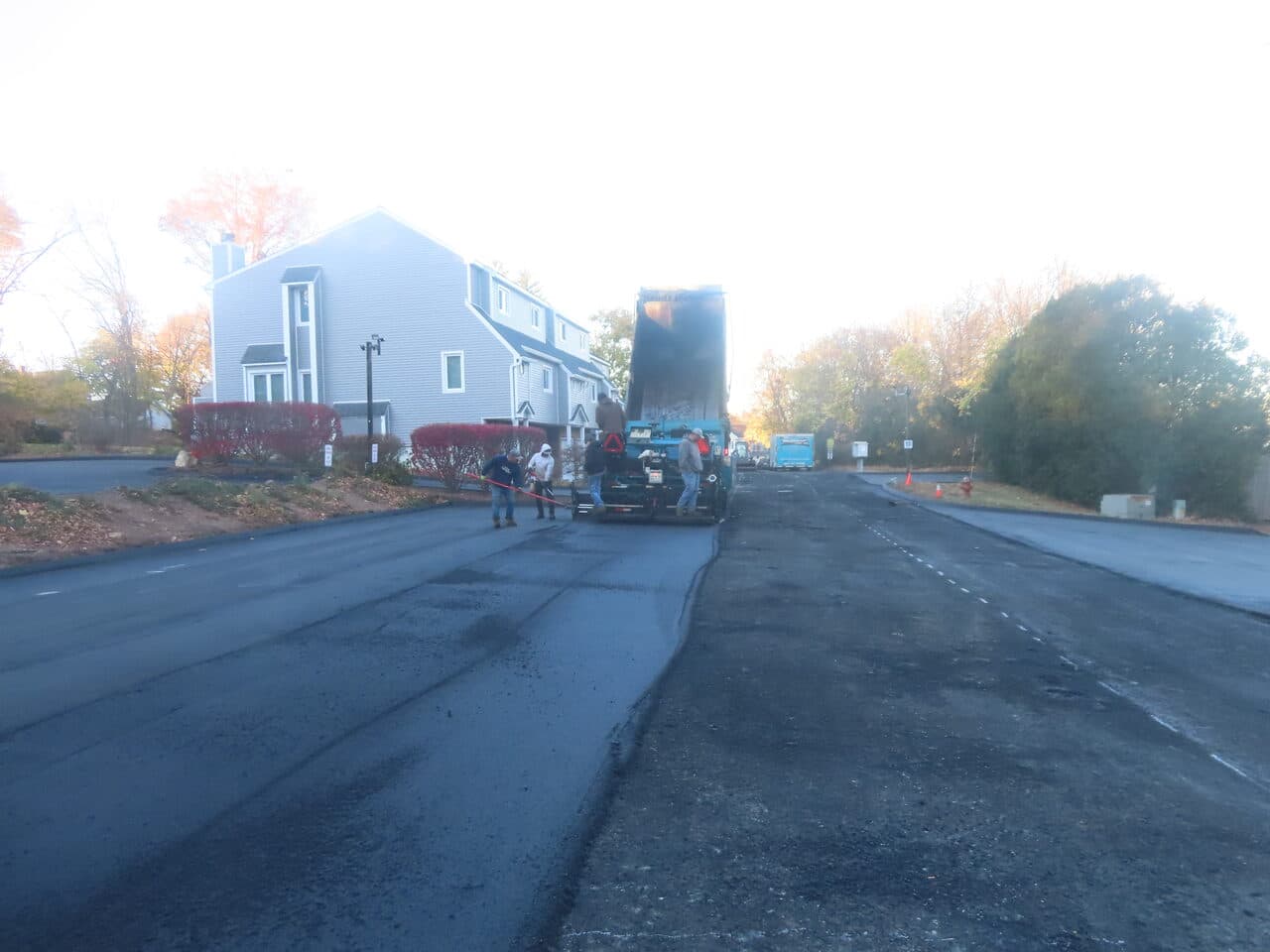Commercial Parking Lot Paving project in Meriden, CT — paving machine laying new road