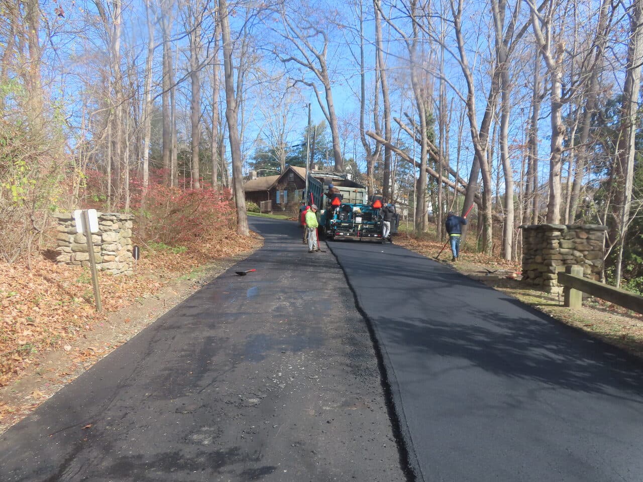 Roadway Paving project in Guilford, CT — newly paved private lane with crew