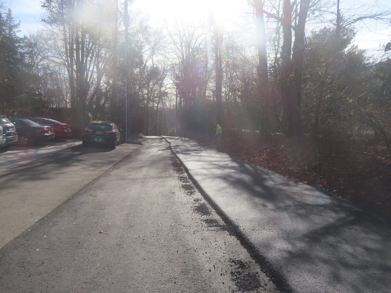 Roadway Paving project in Guilford, CT — fresh asphalt edge near parking