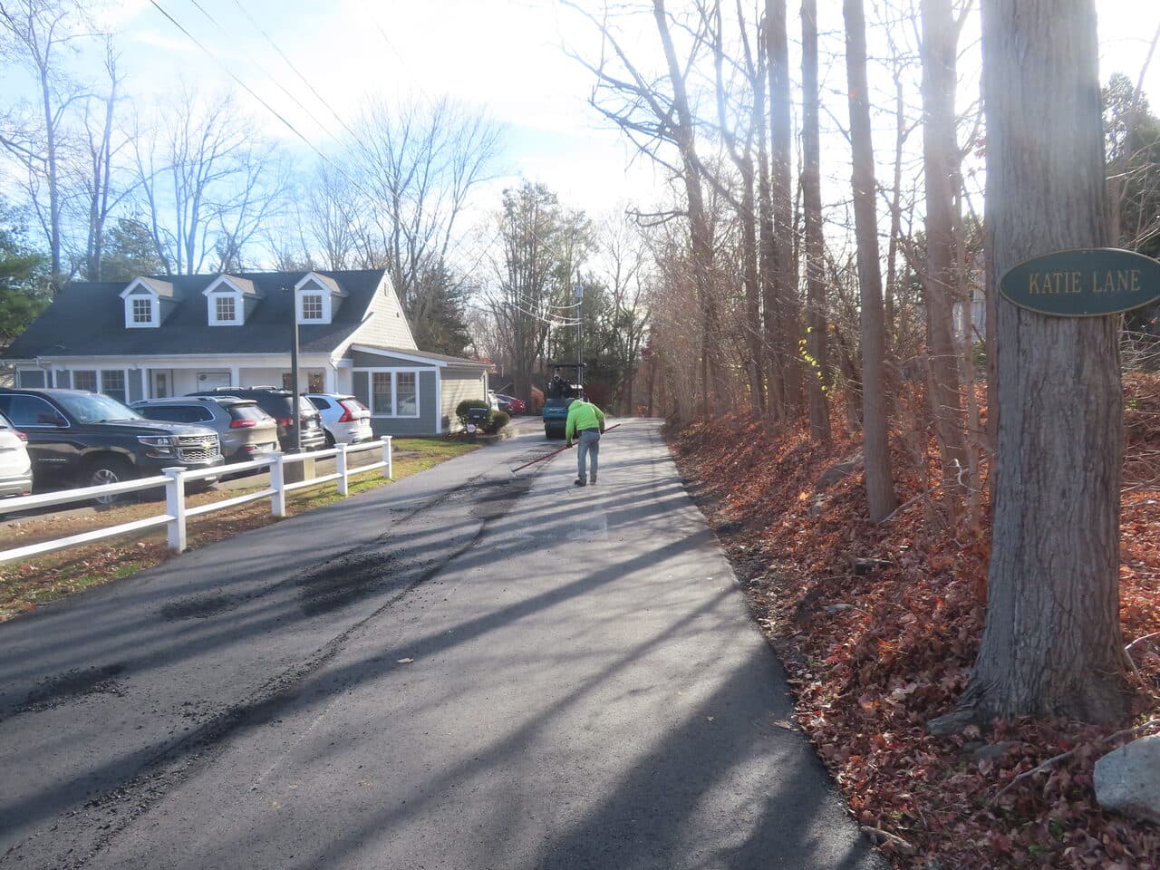 Roadway Paving project in Guilford, CT — Katie Lane fresh paving with worker
