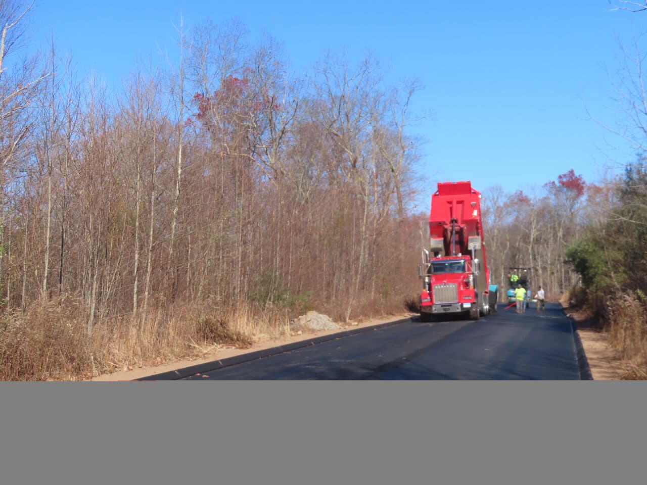 Roadway Paving project in Higganum, CT — dump truck feeding paver crew