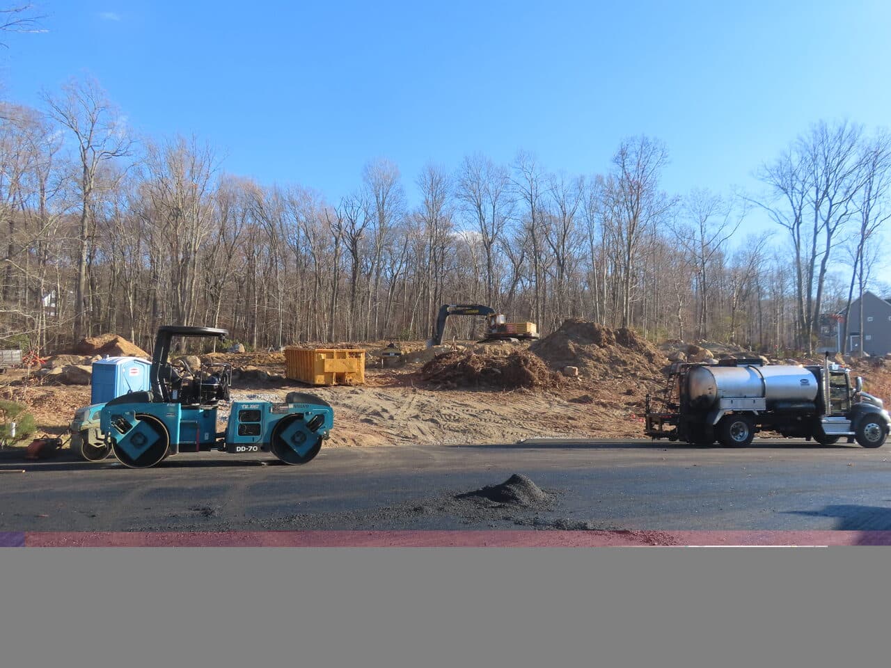 Roadway Paving project in Higganum, CT — roller and water truck at site