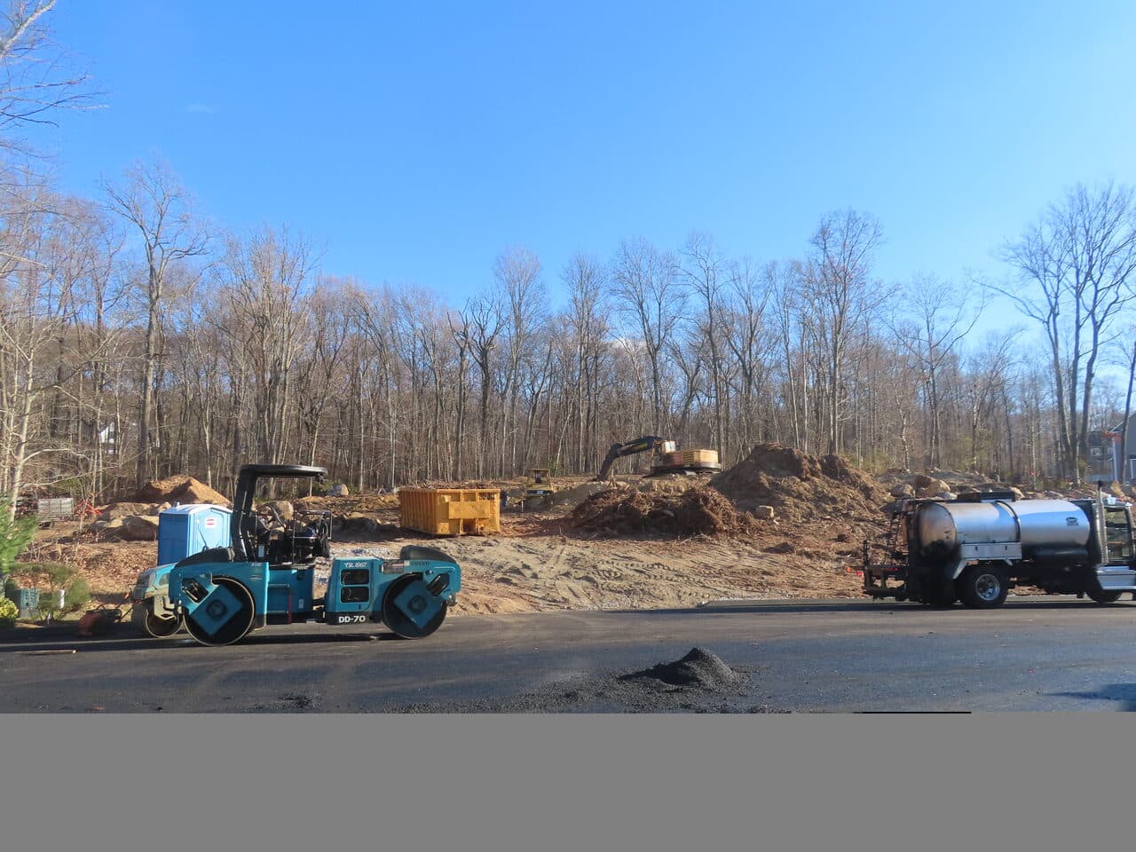 Roadway Paving project in Higganum, CT — roller and water truck at site