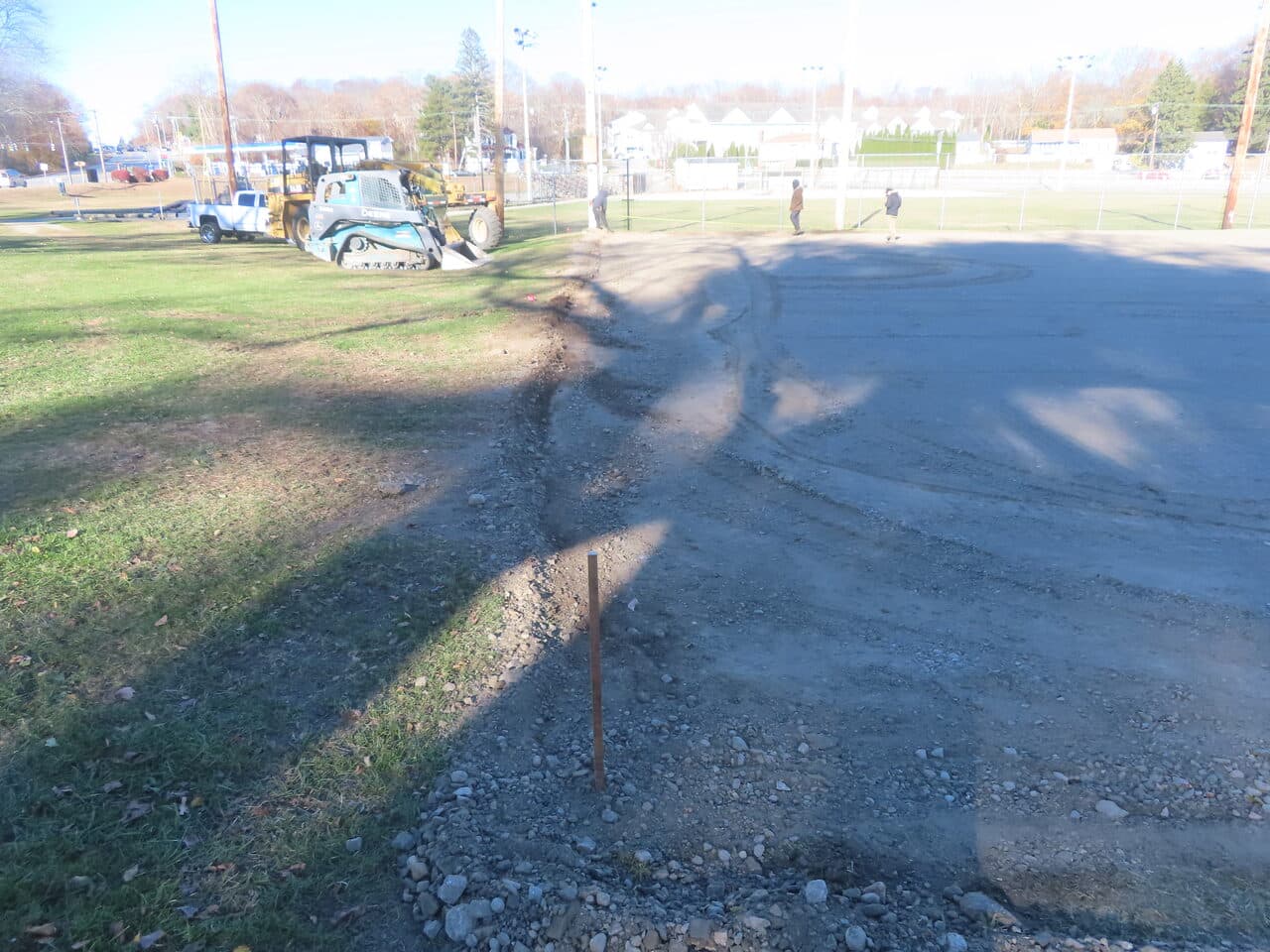 Commercial Parking Lot Paving project in Groton, CT — site grading with skid steer and equipment