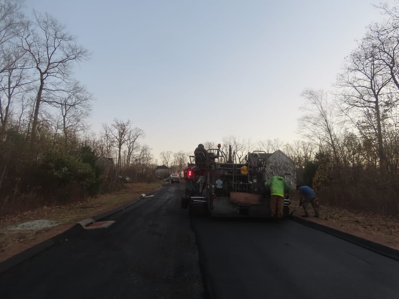 Roadway Paving project in Higganum, CT — paving road at dusk