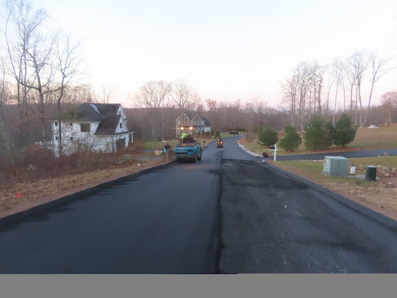 Roadway Paving project in Higganum, CT — fresh paved road wide dusk