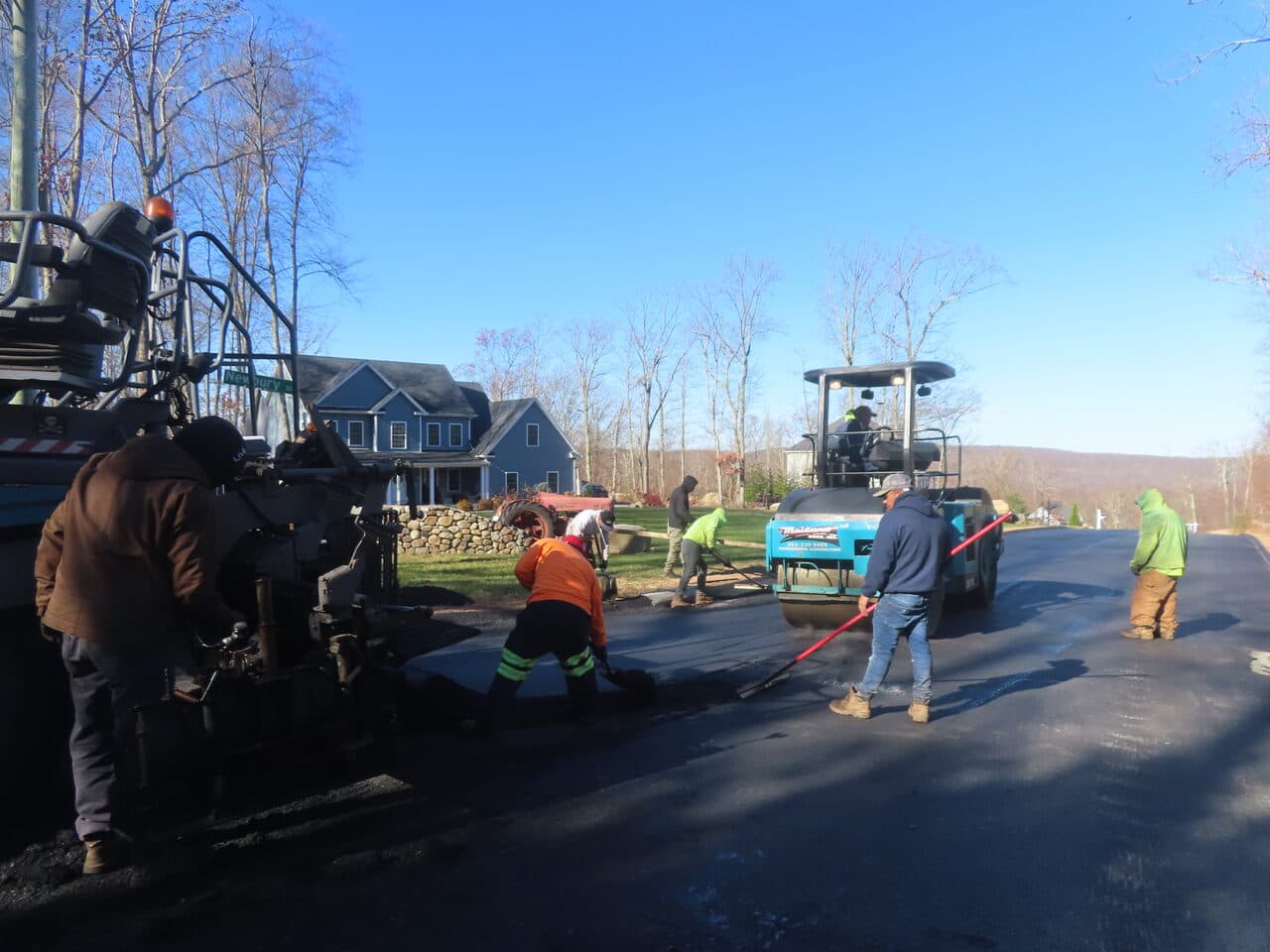 Roadway Paving project in Higganum, CT — crew paving with roller daytime