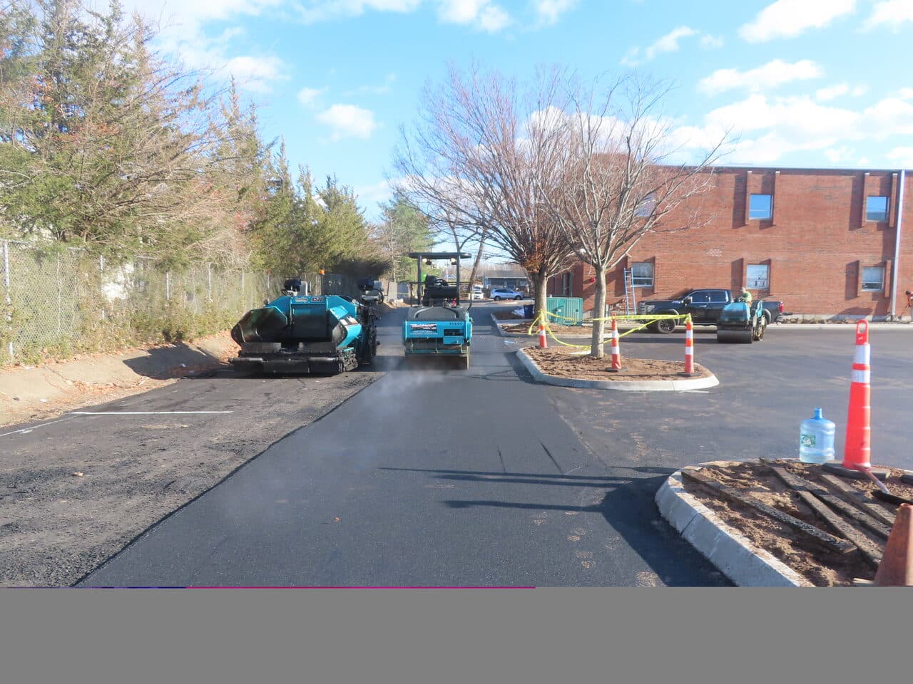 Commercial Parking Lot Paving project in Hartford, CT — paver laying asphalt in lot