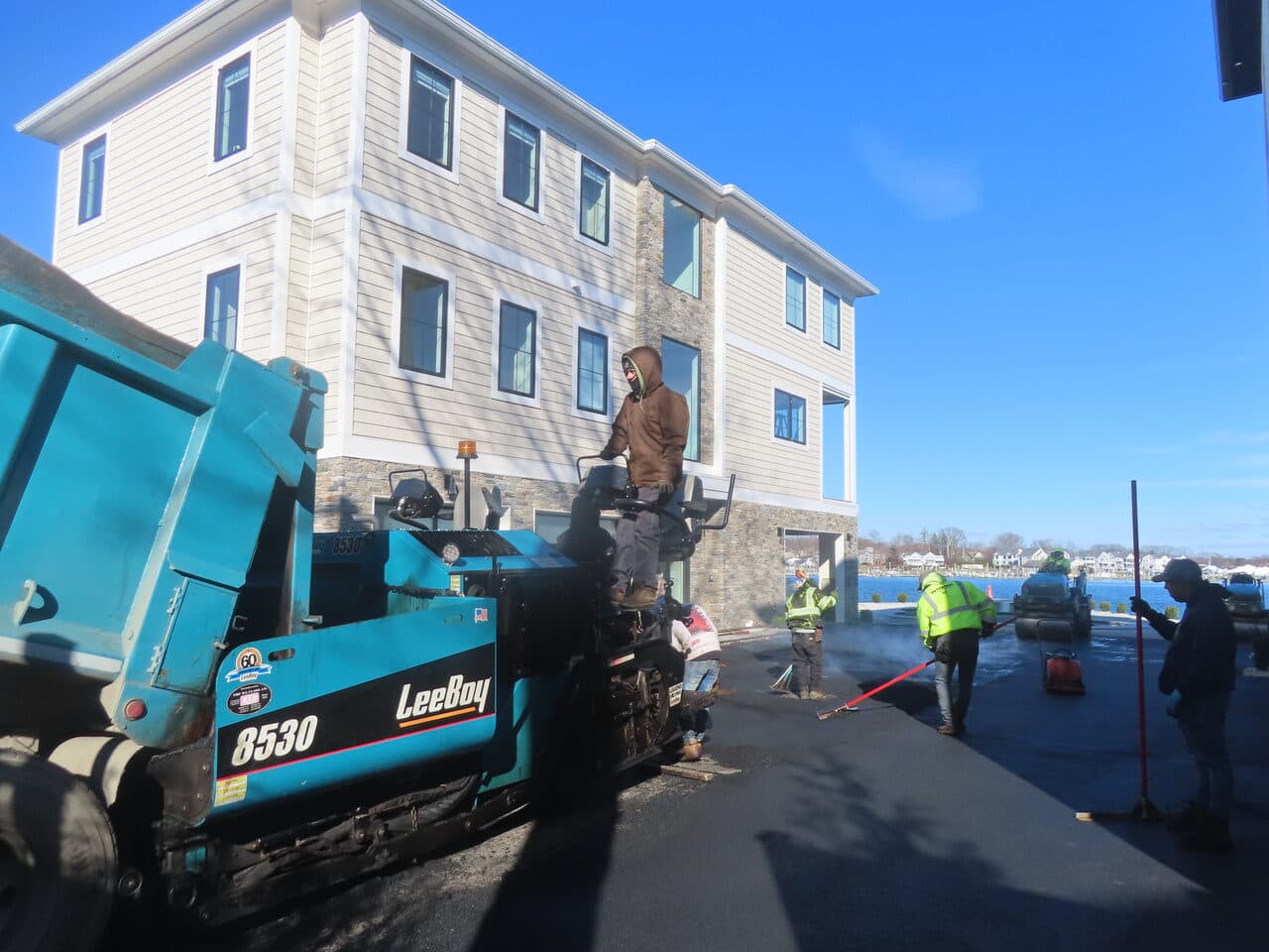 Roadway Paving project in Branford, CT — paving crew with LeeBoy paver waterfront