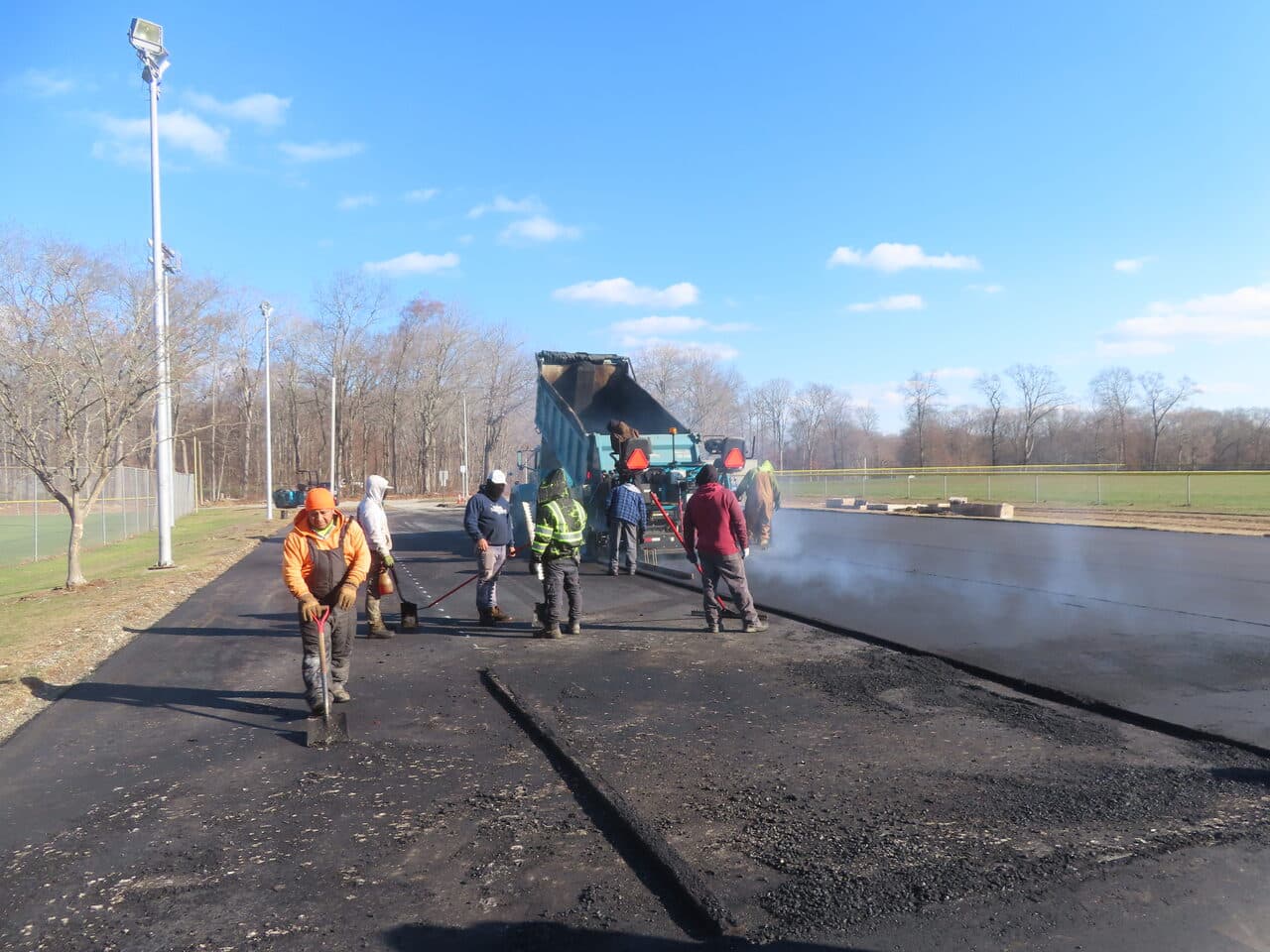 Commercial Parking Lot Paving project in Montville, CT — wide view of fresh asphalt paving