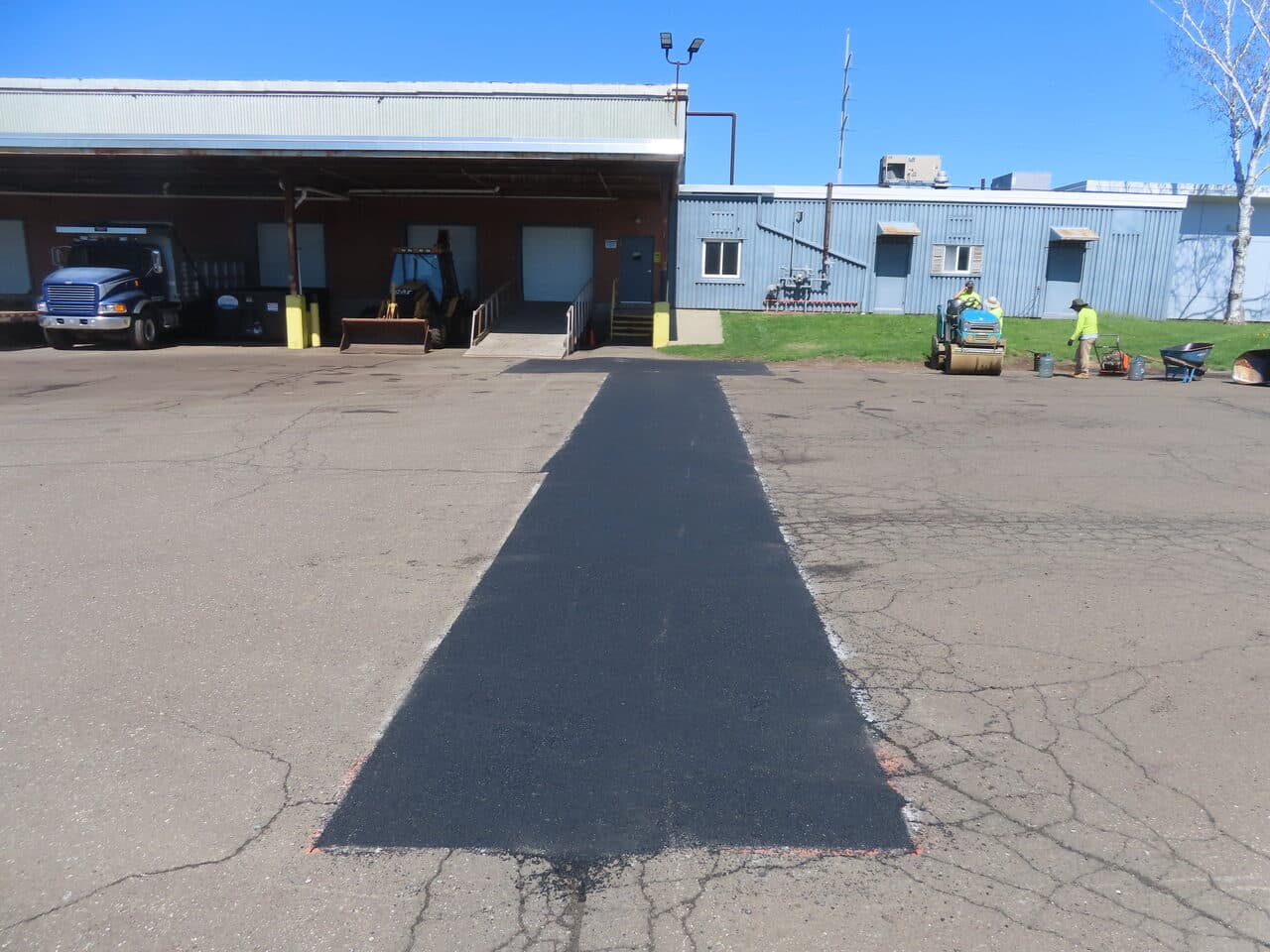 After — Commercial Parking Lot Repair & Patching in Northford, CT (patch areas with cones before compaction)