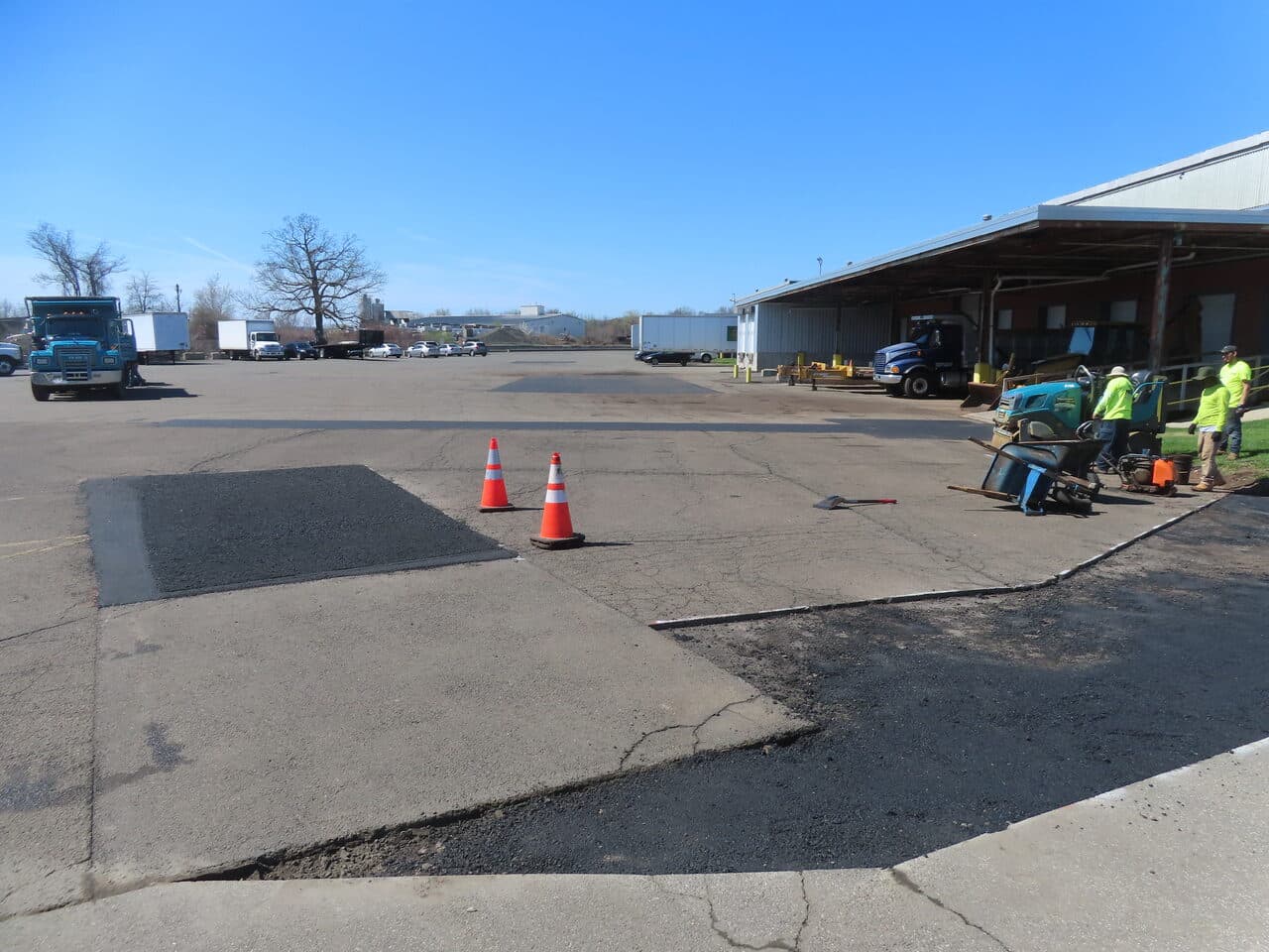 Before — Commercial Parking Lot Repair & Patching in Northford, CT (patch areas with cones before compaction)