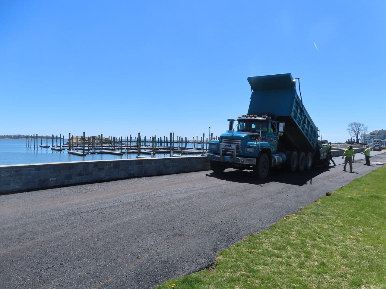 Residential Driveway Paving project in Pine Orchard, CT — dump truck on fresh road by marina