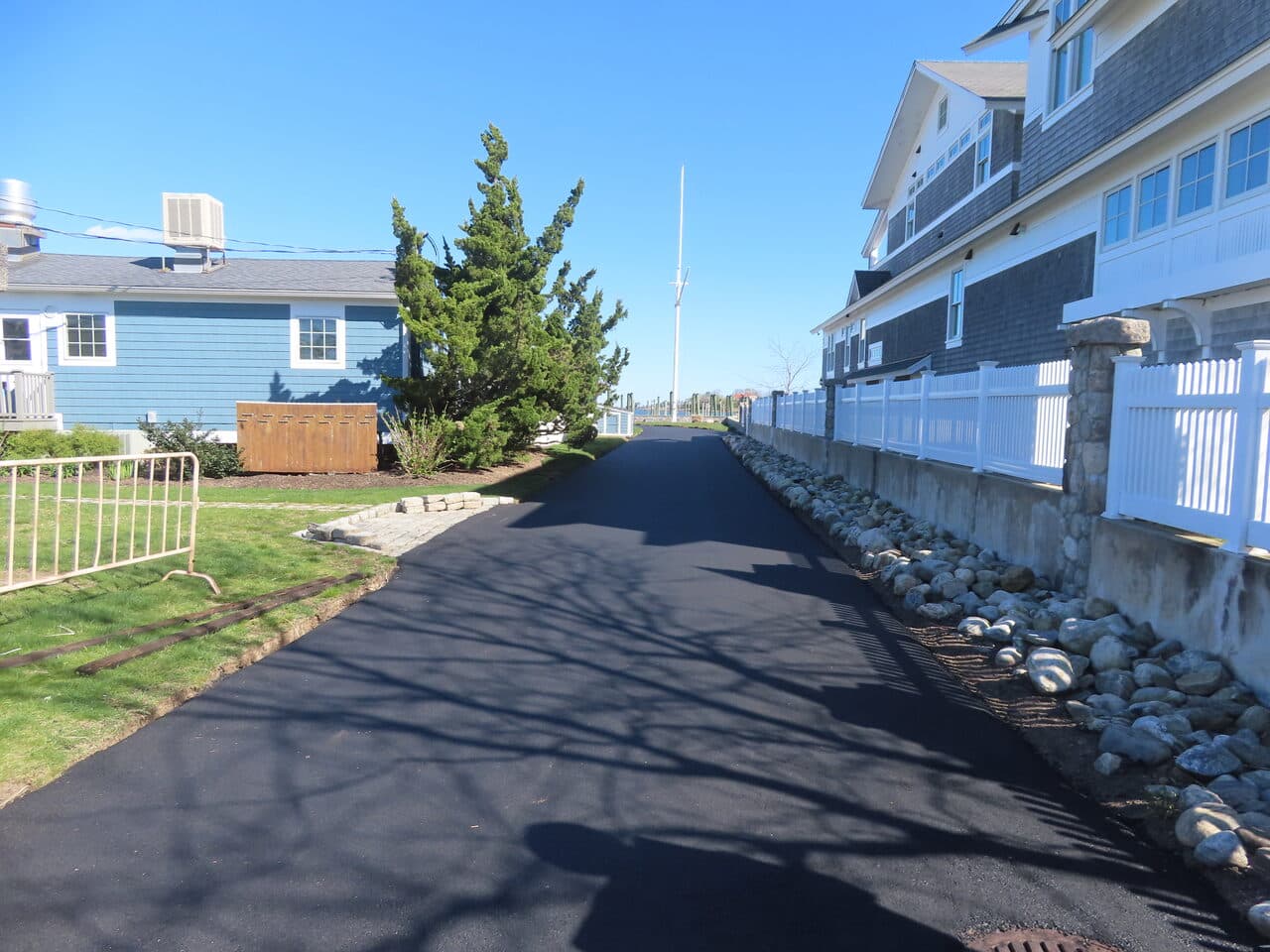 Residential Driveway Paving project in Pine Orchard, CT — finished asphalt drive between homes