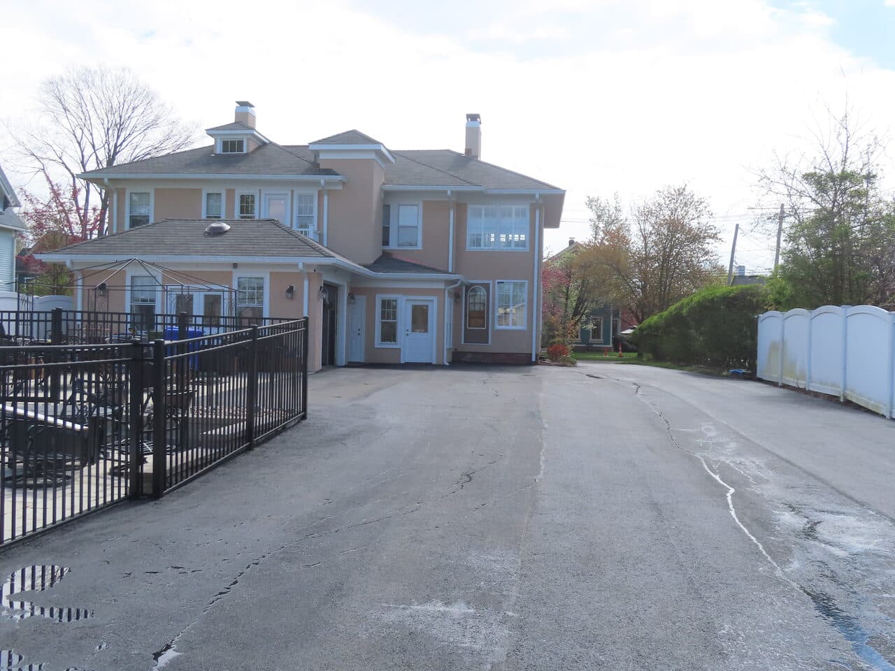 Multi-Stop Residential Driveway Paving project in Wallingford, Branford & Northford, CT — old cracked driveway behind house