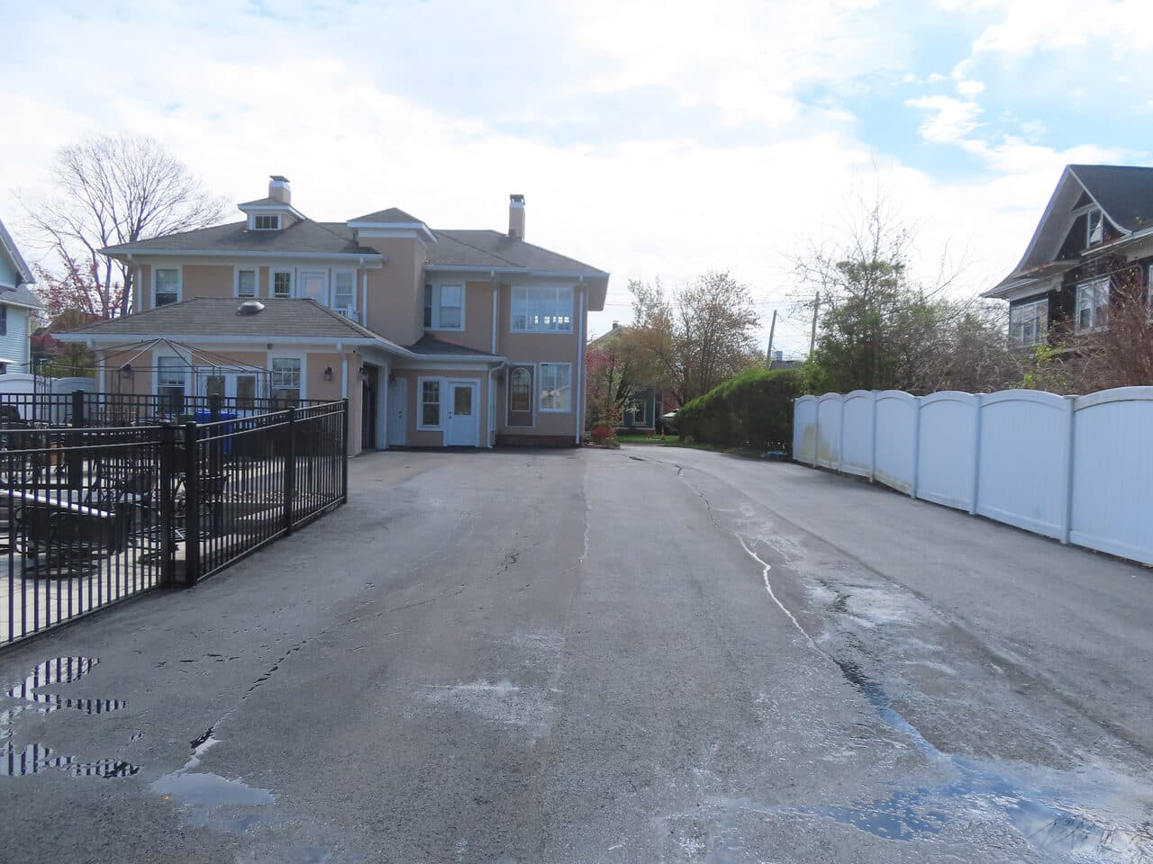 Multi-Stop Residential Driveway Paving project in Wallingford, Branford & Northford, CT — old cracked driveway behind house