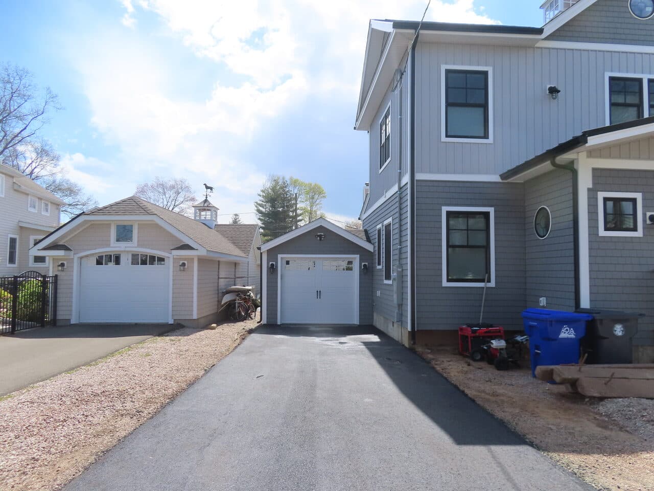 Multi-Stop Residential Driveway Paving project in Wallingford, Branford & Northford, CT — narrow driveway between two garages