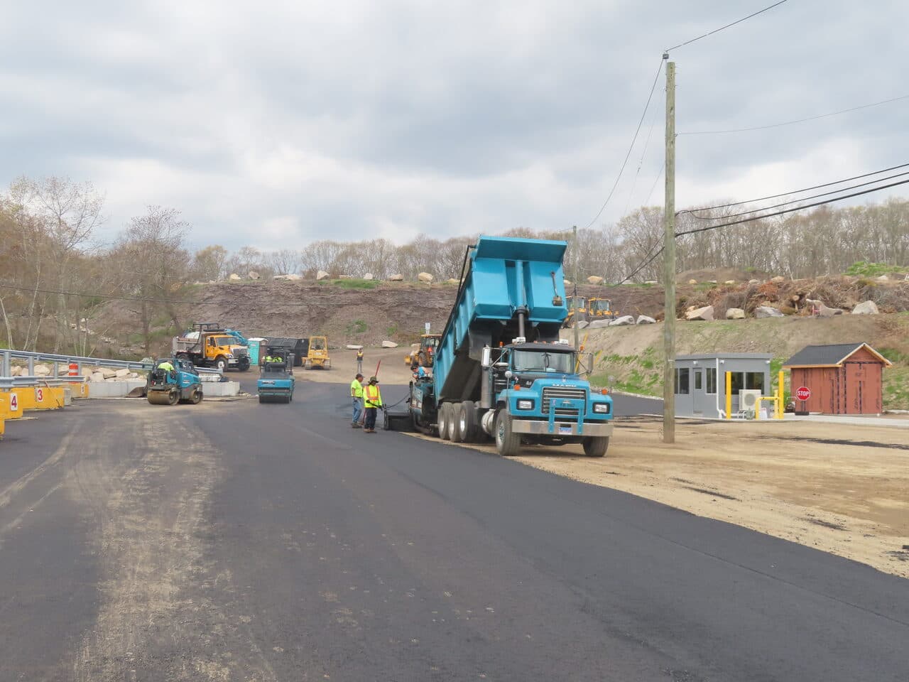 Commercial Parking Lot Paving project in East Lyme, CT — fresh asphalt paving near guard booth